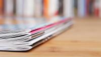 A stack of journals on a table